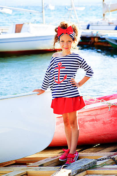 istock young girl with the boat 610554256