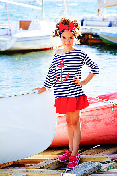 istock young girl with the boat 610554386