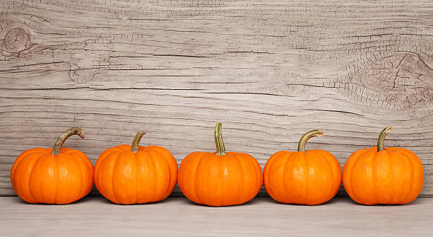 istock Pumpkins over Wooden Background. Harvest 610554528