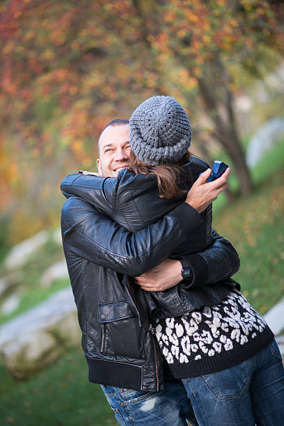 istock Autumn outdoor wedding proposal engagement 610557104
