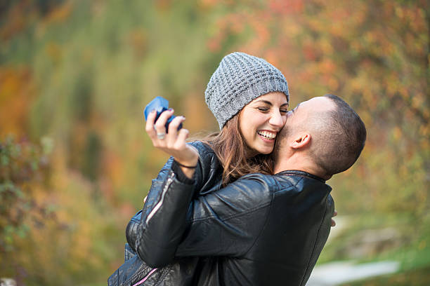 istock Autumn outdoor wedding proposal engagement 610557330