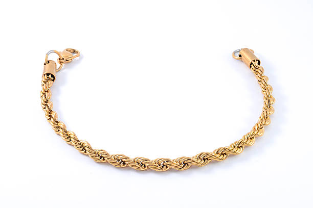 istock thick gold bracelet isolated on white 610557914