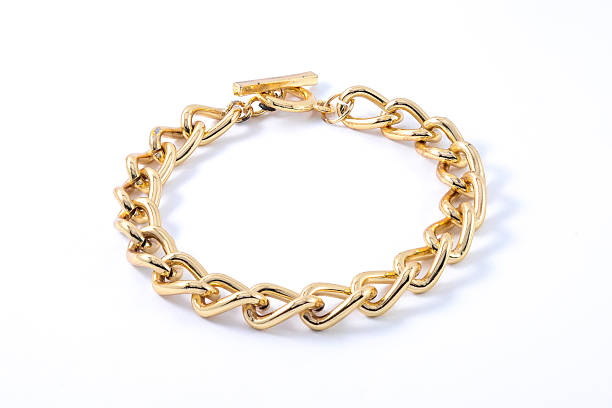 istock thick gold bracelet isolated on white 610557978