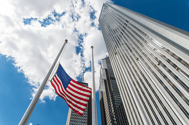 istock American Flag set against tall skyscrapers 610558072