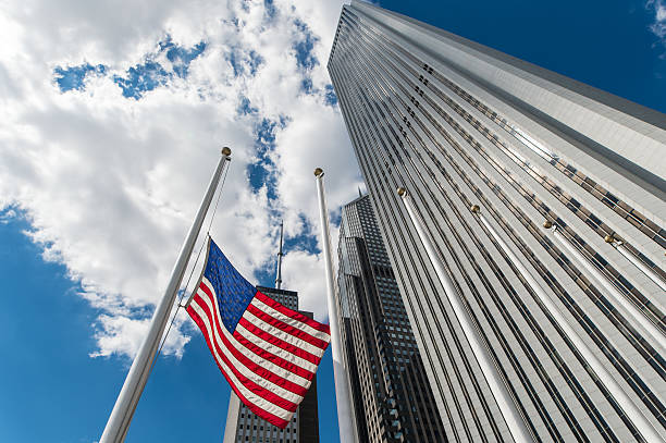 istock American Flag set against tall skyscrapers 610558084