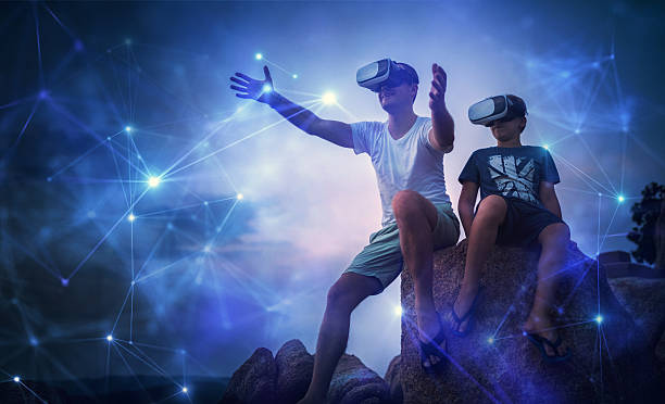 istock Father and son looking at futuristic network using VR glasses 610558308