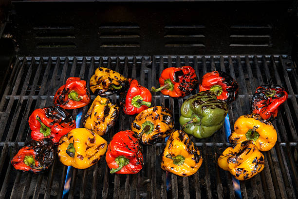 istock Colorful sweet peppers are grilled on barbecue. 610560244