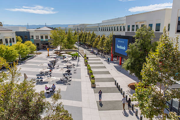 Facebook Menlo Park Campus Headquarters Menlo Park, California United States - August 29, 2016: Looking out at the main campus of Facebook headquarters in Menlo Park California, the online social media and social networking service started in 2004 by Mark Zuckerberg. headquarters photos stock pictures, royalty-free photos & images