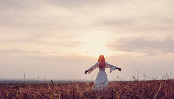 istock Beautiful woman in a meadow 610561754