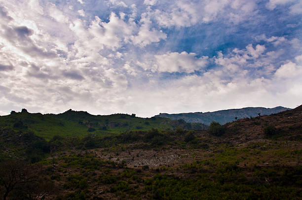 istock Beautiful clouds over the green mountains 610563760