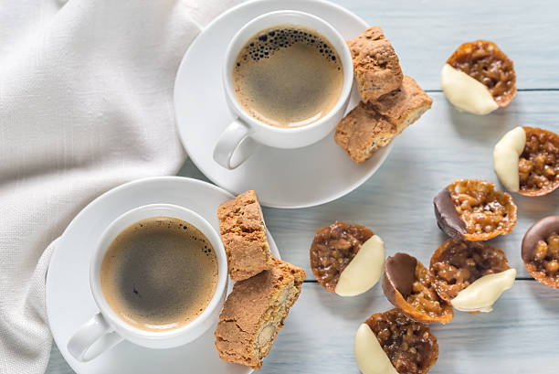 istock Cups of coffee with florentine cookies 610564184