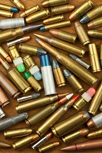 istock Gun control rights weapon. Different types of ammunition. 610565510