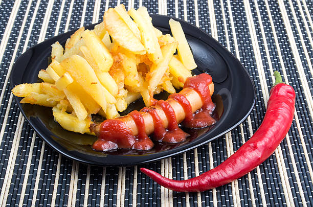 istock Fried potatoes and sausage with tomato ketchup 610567504