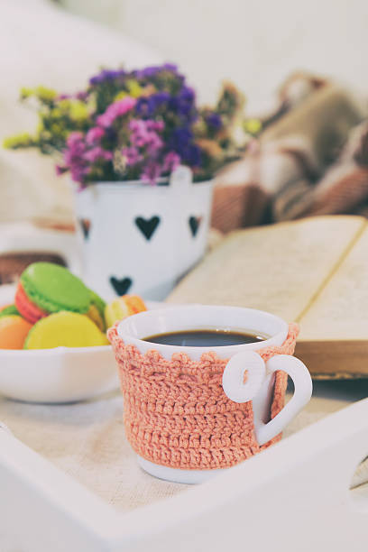istock Breakfast in bed with hot coffee and macaroons. 610571572