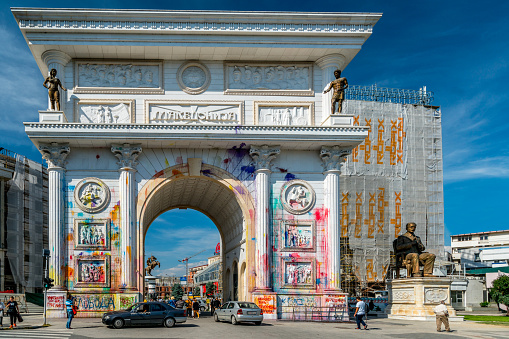 Skopje, Macedonia - September 24, 2016: Splashes of color on Porta Macedonia, the triumphal arch in the center of Skopje.