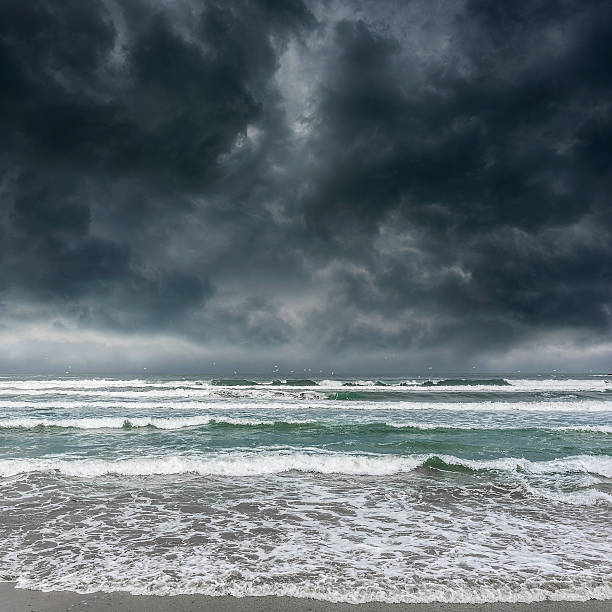 istock Dark stormy sky and sea waves. 610573810