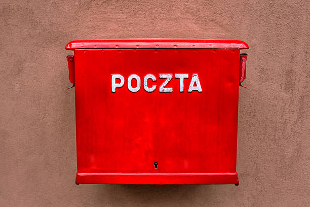 istock Red mailbox hanging on the wall in Poland 610573858