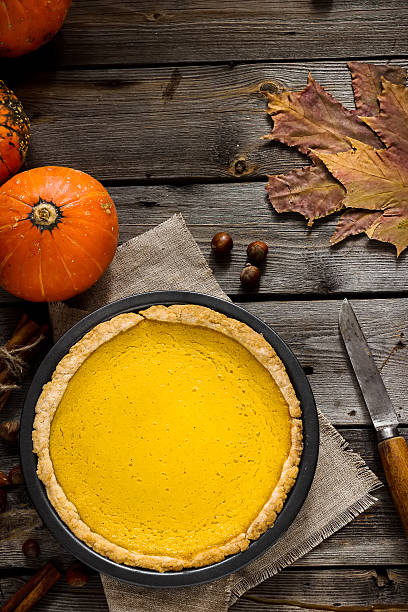 istock Pumpkin pie for Thanksgiving on old rustic background. 610574250