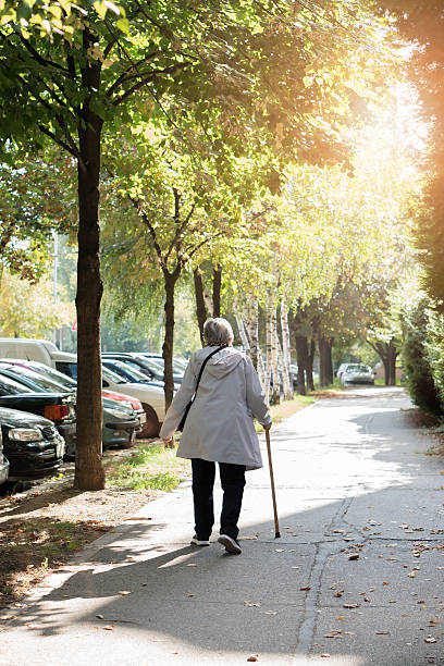 istock Senior woman walking 610574810