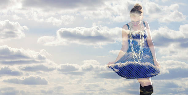 istock free woman through the clouds 610575126