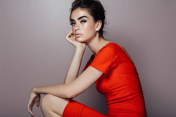 istock Studioshot of young beautiful woman on white background 610577202