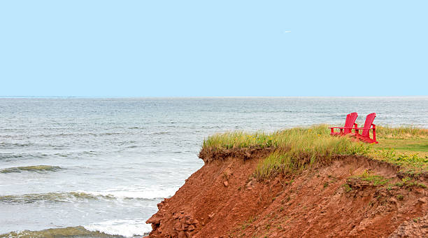 istock Shoreline plus red chairs  Prince Edward Island National Park 610578308