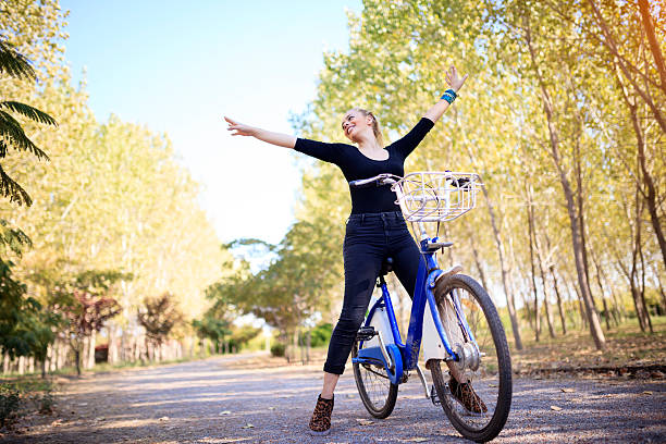 istock Cycling Young Blonde Woman At Forest 610578584