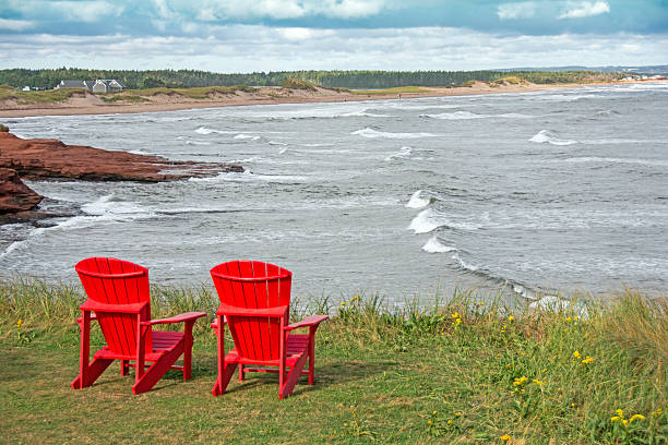 istock Shoreline plus red chairs  Prince Edward Island National Park 610578600