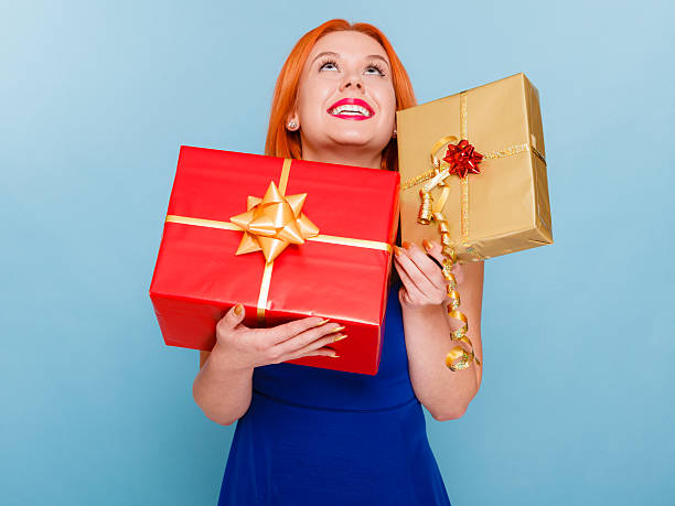 istock holidays love happiness concept - girl with gift boxes 610579044