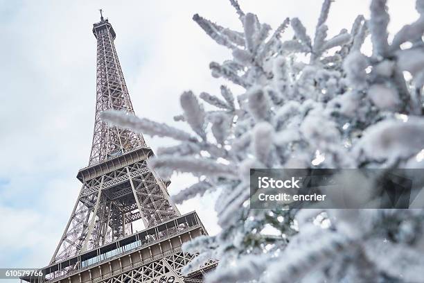 Christmas Tree Covered With Snow Near The Eiffel Tower Stock Photo - Download Image Now