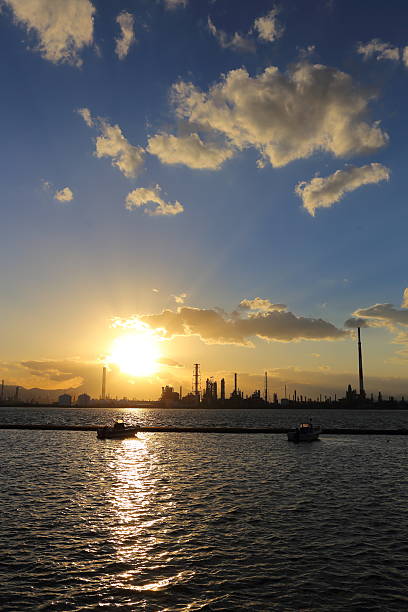 istock Factory and the ship and the sunset 610579780