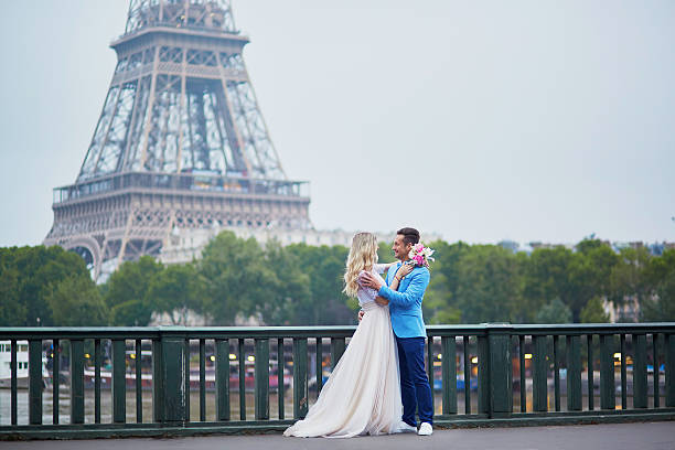istock Just married couple near the Eiffel tower in Paris 610580060