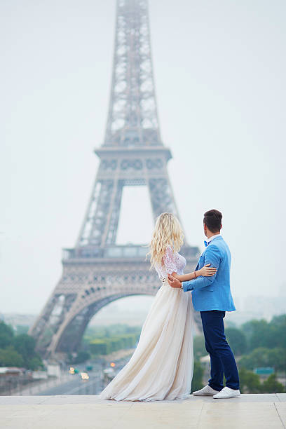 istock Just married couple near the Eiffel tower in Paris 610580806