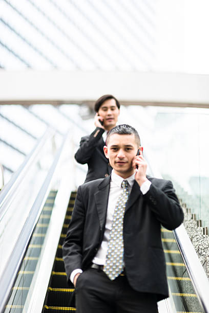 istock japanese Business on the escalator 610580924