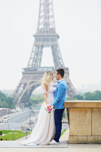 istock Just married couple near the Eiffel tower in Paris 610581982