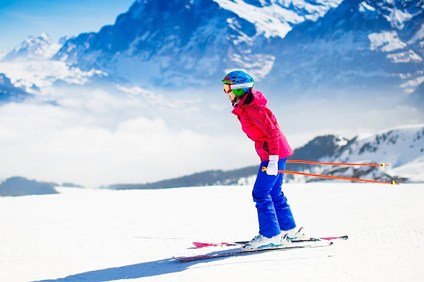 istock Young woman skiing in the mountains. 610582404