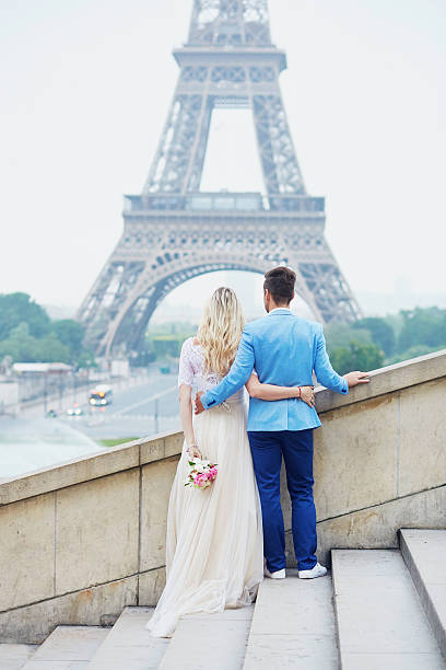 istock Just married couple near the Eiffel tower in Paris 610582474