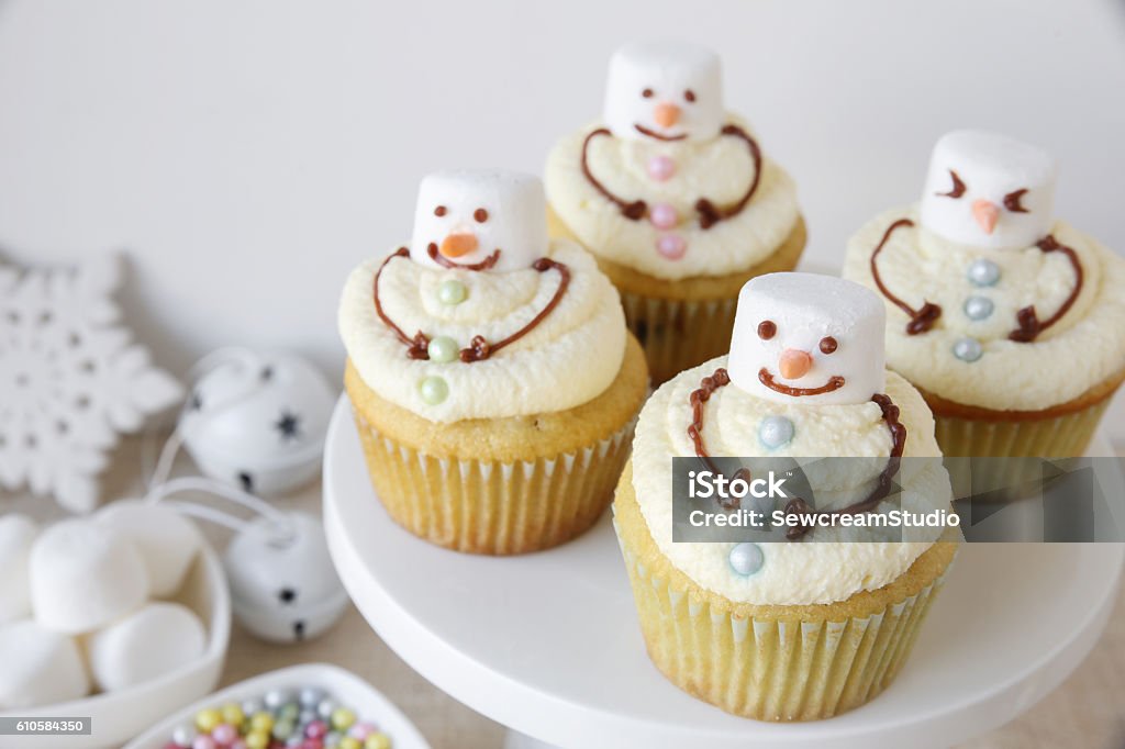 Fun homemade melting snowman cupcakes for kids Cupcake Stock Photo