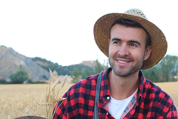 istock Happy young farmer boy in hat 610584784