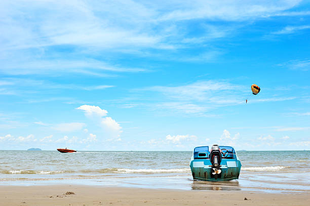 Parasailing in a blue sky in Pattaya beach