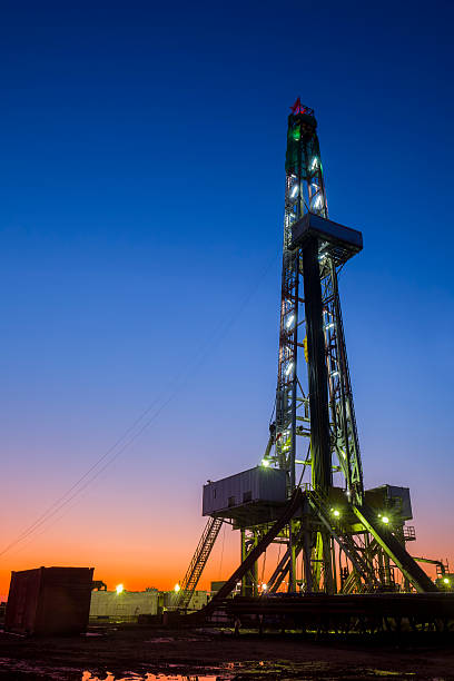 istock oilfield derrick at night 610645996