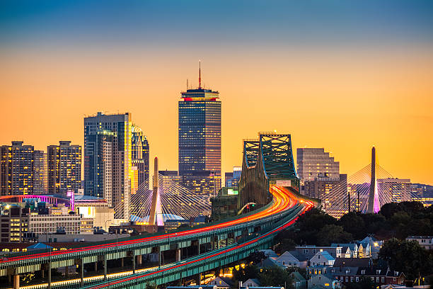 rush hour traffic on tobin bridge in boston - boston sunset city bridge imagens e fotografias de stock