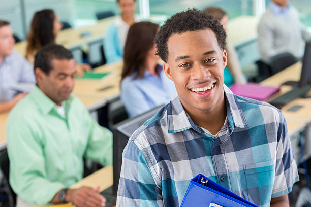 istock Handsome young man in college or continuing education class 610647586