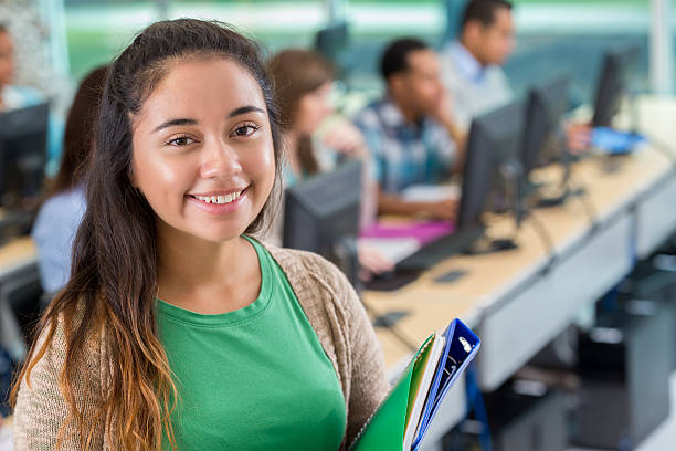istock Beautiful college girl in computer lab 610647622