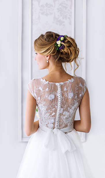 istock Bride. A young girl in  white dress. 610647648