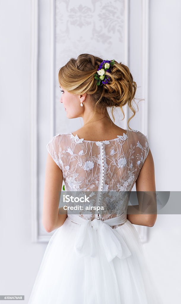 Bride. A young girl in  white dress. Bride. A young girl in a white dress. Bride's back. Bride Stock Photo