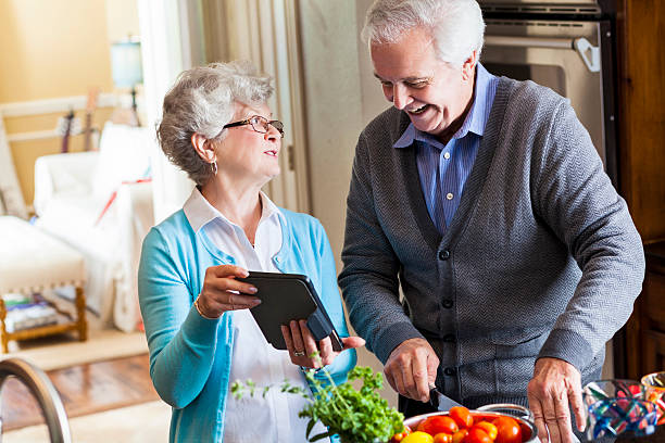 istock Husband and wife cook together 610650686