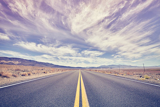 istock Endless desert road in Death Valley, travel concept. 610651582