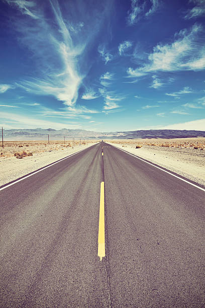istock Vintage toned desert road, travel concept. 610651628