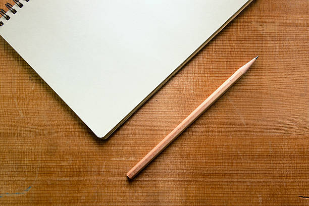 istock Top view of notebook on wood desk 610652448